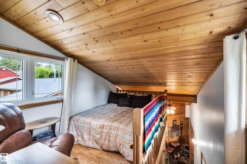 Bedroom featuring a vaulted wood ceiling and wood finished floors - 605 6St. Ross Haven, Rural Lac Ste. Anne County, AB - Indoor Photo Showing Bedroom
