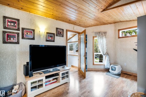 Living area with wood ceiling and wood finished floors - 605 6St. Ross Haven, Rural Lac Ste. Anne County, AB - Indoor