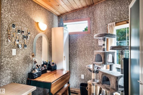Wine area featuring crown molding - 605 6St. Ross Haven, Rural Lac Ste. Anne County, AB - Indoor Photo Showing Other Room