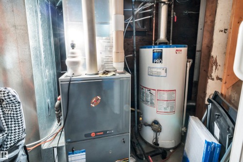 Utility room featuring water heater and heating unit - 605 6St. Ross Haven, Rural Lac Ste. Anne County, AB - Indoor Photo Showing Basement