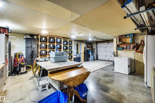 Garage with freestanding refrigerator - 605 6St. Ross Haven, Rural Lac Ste. Anne County, AB - Indoor Photo Showing Garage