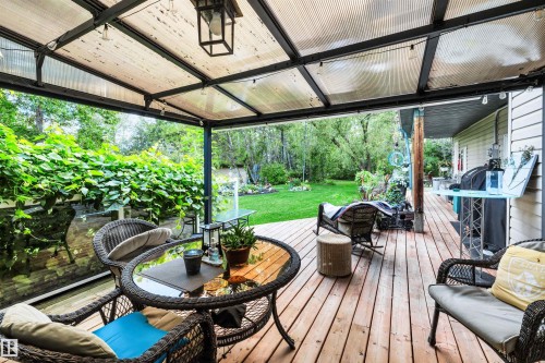 Wooden deck with a yard - 605 6St. Ross Haven, Rural Lac Ste. Anne County, AB - Outdoor With Deck Patio Veranda With Exterior