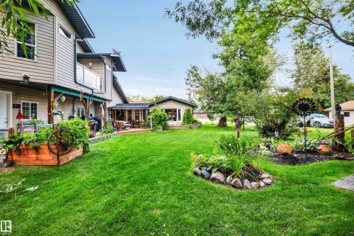 View of grassy yard featuring a balcony - 605 6St. Ross Haven, Rural Lac Ste. Anne County, AB - Outdoor With Deck Patio Veranda