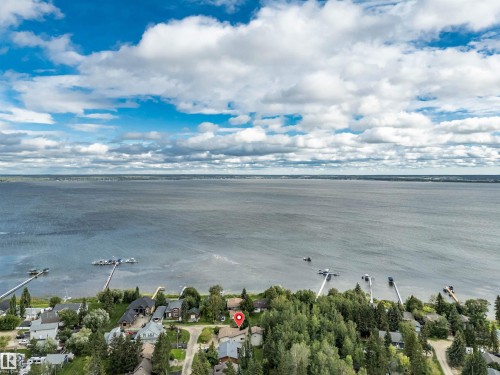 Aerial perspective of suburban area with a large body of water - 605 6St. Ross Haven, Rural Lac Ste. Anne County, AB - Outdoor With Body Of Water With View