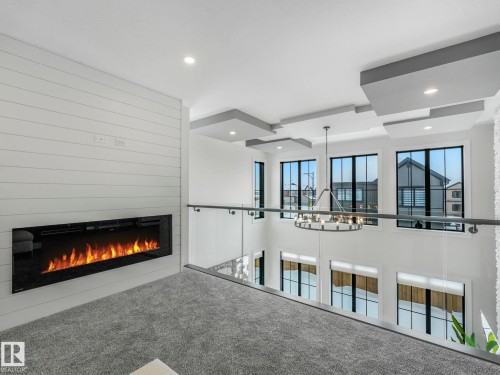 41 Cannes Cove, St. Albert, AB - Indoor Photo Showing Other Room With Fireplace