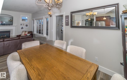 6152 Stinson Way, Edmonton, AB - Indoor Photo Showing Dining Room With Fireplace