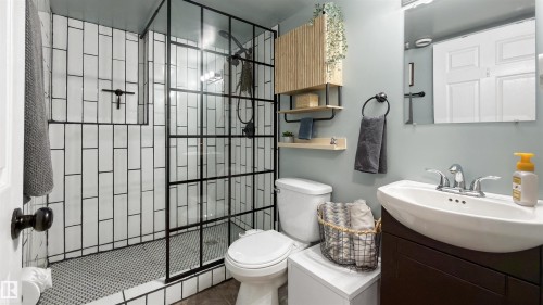 Bathroom featuring vanity, a tile shower, and tile patterned flooring - 7 Chungo Drive, Devon, AB - Indoor Photo Showing Bathroom