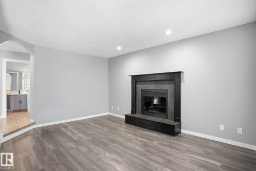 11019 10 Avenue, Edmonton, AB - Indoor Photo Showing Living Room With Fireplace
