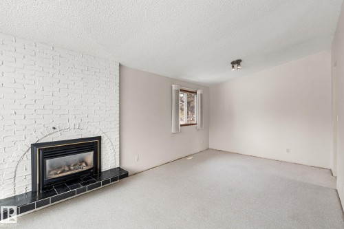 34 Andrew Crescent, St. Albert, AB - Indoor Photo Showing Living Room With Fireplace
