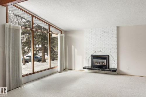 34 Andrew Crescent, St. Albert, AB - Indoor Photo Showing Other Room With Fireplace