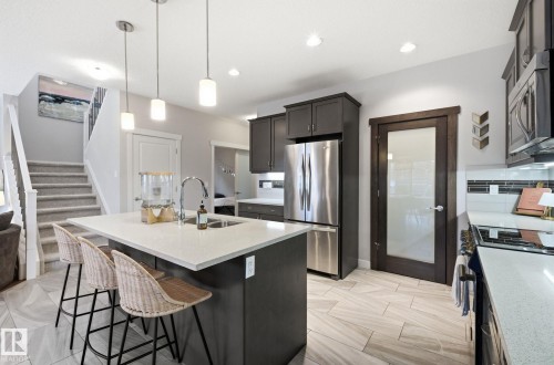 69 Avonlea Way, Spruce Grove, AB - Indoor Photo Showing Kitchen With Upgraded Kitchen