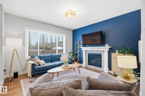 69 Avonlea Way, Spruce Grove, AB - Indoor Photo Showing Living Room With Fireplace