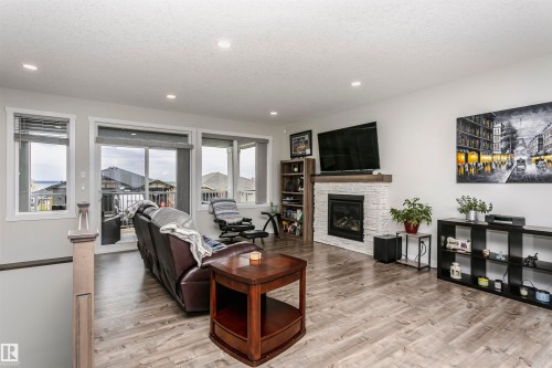 611 55101 Ste Anne Trail, Rural Lac Ste. Anne County, AB - Indoor Photo Showing Living Room With Fireplace