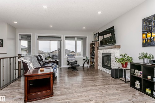 611 55101 Ste Anne Trail, Rural Lac Ste. Anne County, AB - Indoor Photo Showing Living Room With Fireplace