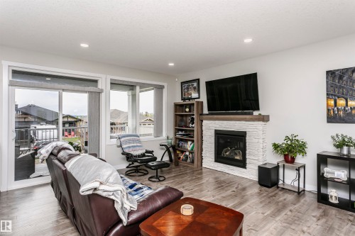 611 55101 Ste Anne Trail, Rural Lac Ste. Anne County, AB - Indoor Photo Showing Living Room With Fireplace