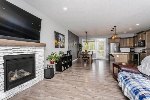 611 55101 Ste Anne Trail, Rural Lac Ste. Anne County, AB - Indoor Photo Showing Living Room With Fireplace
