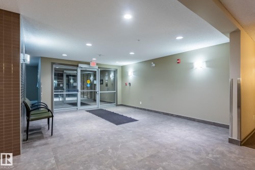 Building lobby featuring recessed lighting - 207 2203 44 Avenue, Edmonton, AB - Indoor Photo Showing Other Room