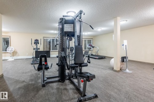 Exercise area featuring a textured ceiling - 207 2203 44 Avenue, Edmonton, AB - Indoor Photo Showing Gym Room