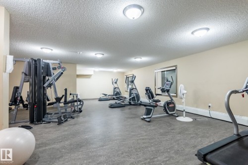 Exercise room with a textured ceiling - 207 2203 44 Avenue, Edmonton, AB - Indoor Photo Showing Gym Room
