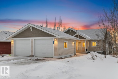 View of front of property featuring roof with shingles - 523 55101 Ste. Anne Trail, Rural Lac Ste. Anne County, AB - Outdoor