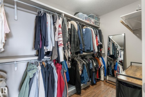 Walk in closet featuring wood finished floors - 523 55101 Ste. Anne Trail, Rural Lac Ste. Anne County, AB - Indoor With Storage