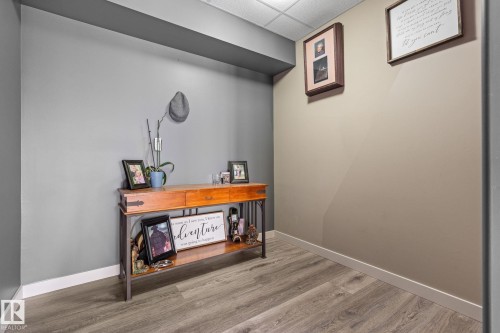 Office space featuring a paneled ceiling and light wood finished floors - 523 55101 Ste. Anne Trail, Rural Lac Ste. Anne County, AB - Indoor Photo Showing Other Room