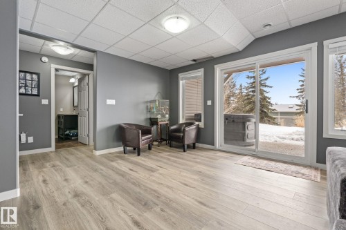 Sitting room with a paneled ceiling and light wood-style flooring - 523 55101 Ste. Anne Trail, Rural Lac Ste. Anne County, AB - Indoor Photo Showing Other Room