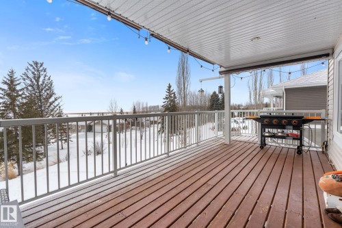 Snow covered deck with area for grilling - 523 55101 Ste. Anne Trail, Rural Lac Ste. Anne County, AB - Outdoor With Deck Patio Veranda With Exterior