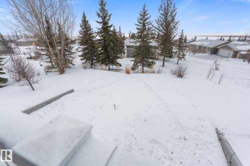 View of yard covered in snow - 523 55101 Ste. Anne Trail, Rural Lac Ste. Anne County, AB - Outdoor With View