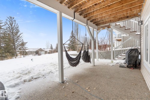 View of patio / terrace with stairs and area for grilling - 523 55101 Ste. Anne Trail, Rural Lac Ste. Anne County, AB - Outdoor With Exterior