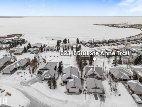 Aerial view of residential area - 523 55101 Ste. Anne Trail, Rural Lac Ste. Anne County, AB - Outdoor With Body Of Water With View