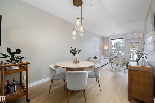 Dining room with light wood-type flooring - 94 2560 Pegasus Boulevard, Edmonton, AB - Indoor Photo Showing Dining Room