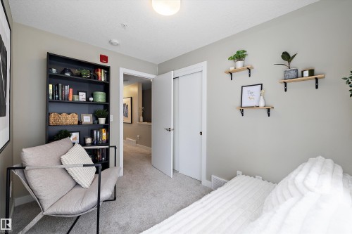 Bedroom featuring light carpet, a closet, and a textured ceiling - 94 2560 Pegasus Boulevard, Edmonton, AB - Indoor Photo Showing Bedroom