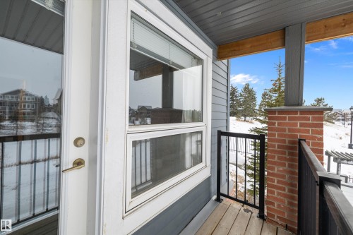 View of snow covered back of property - 94 2560 Pegasus Boulevard, Edmonton, AB - Outdoor With Deck Patio Veranda With Exterior