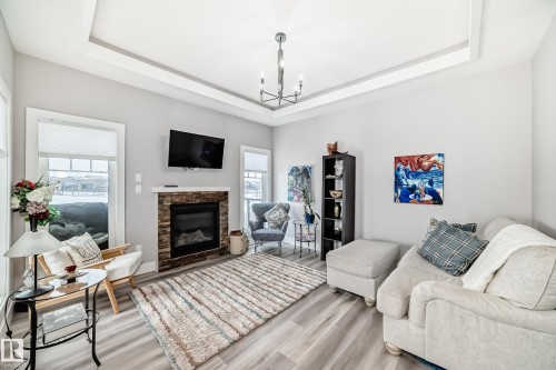 139 Kidd Crescent, Leduc, AB - Indoor Photo Showing Living Room With Fireplace