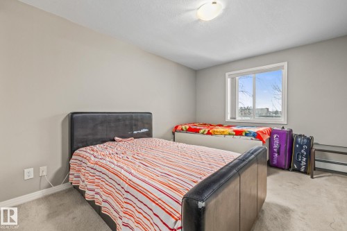 Bedroom with light carpet - 221 5005 165 Avenue, Edmonton, AB - Indoor Photo Showing Bedroom
