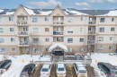 View of apartment building / complex with uncovered parking - 221 5005 165 Avenue, Edmonton, AB  - Outdoor With Balcony With Facade 