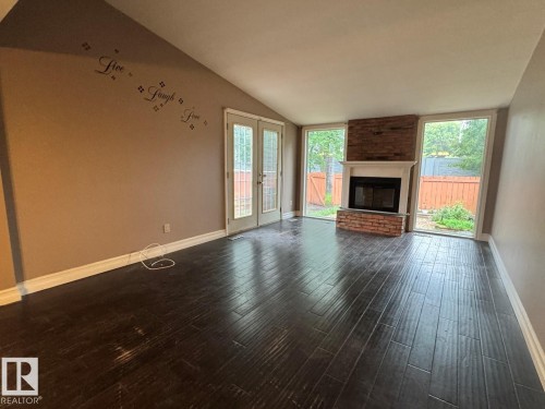6612 36A Avenue, Edmonton, AB - Indoor Photo Showing Living Room With Fireplace