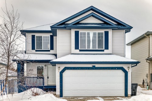 View of front of home featuring a garage and driveway - 4619 151 Avenue Nw, Edmonton, AB - Outdoor