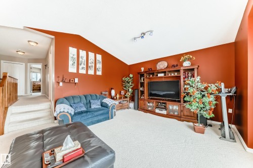 Carpeted living room with baseboards - 4619 151 Avenue Nw, Edmonton, AB - Indoor Photo Showing Living Room