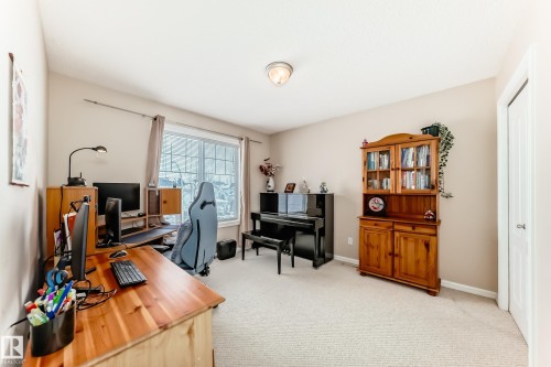Home office featuring light carpet and baseboards - 4619 151 Avenue Nw, Edmonton, AB - Indoor Photo Showing Office