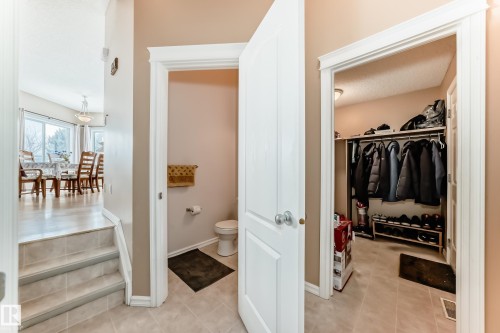 Bathroom with a walk in closet and light tile patterned floors - 4619 151 Avenue Nw, Edmonton, AB - Indoor