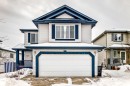 View of front facade with a garage and covered porch - 4619 151 Avenue Nw, Edmonton, AB  - Outdoor With Facade 