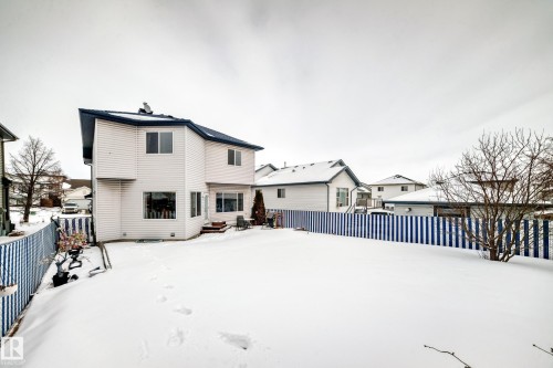 Snow covered back of property with a fenced backyard - 4619 151 Avenue Nw, Edmonton, AB - Outdoor