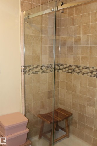 Full bathroom featuring a shower stall and toilet - 12432 134 Street, Edmonton, AB - Indoor Photo Showing Bathroom