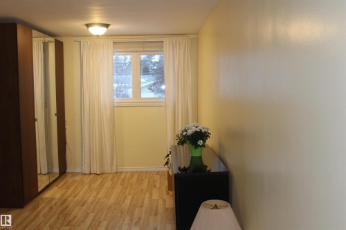 Entryway with wood finished floors and baseboards - 12432 134 Street, Edmonton, AB - Indoor Photo Showing Other Room