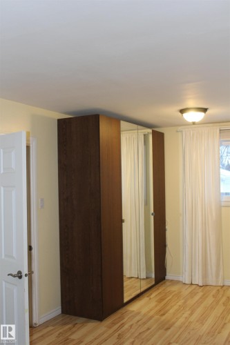 Unfurnished bedroom featuring light wood finished floors and baseboards - 12432 134 Street, Edmonton, AB - Indoor Photo Showing Other Room