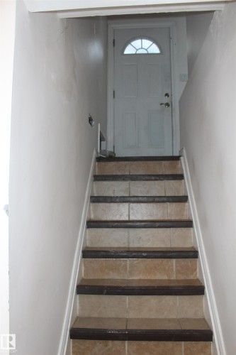 Stairway with baseboards - 12432 134 Street, Edmonton, AB - Indoor Photo Showing Other Room