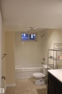 Bathroom featuring vanity and shower / tub combination - 