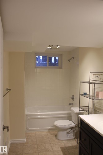 Bathroom featuring vanity and shower / tub combination - 12432 134 Street, Edmonton, AB - Indoor Photo Showing Bathroom